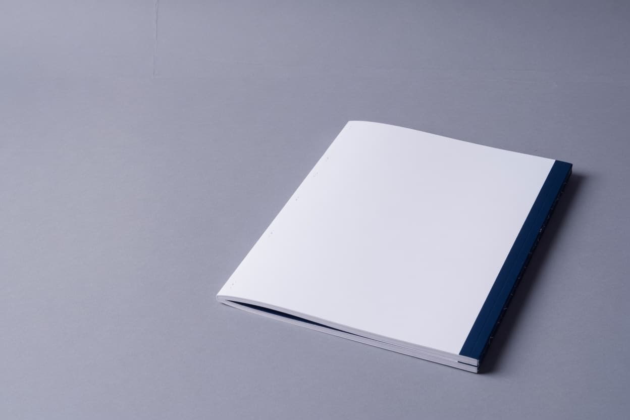 Clean market report booklet on a neutral surface